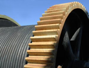 Close-up of a protective guard on mining machinery, emphasizing the importance of maintaining guard integrity for equipment safety.