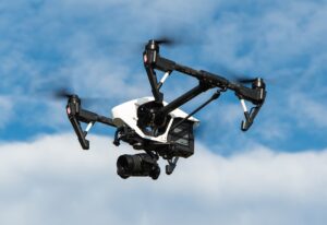 Drone flying above a mining site, representing modern equipment used to support mining machinery safety requirements.